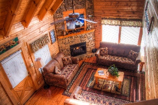 Living room w/ fireplace & queen sleeper sofa